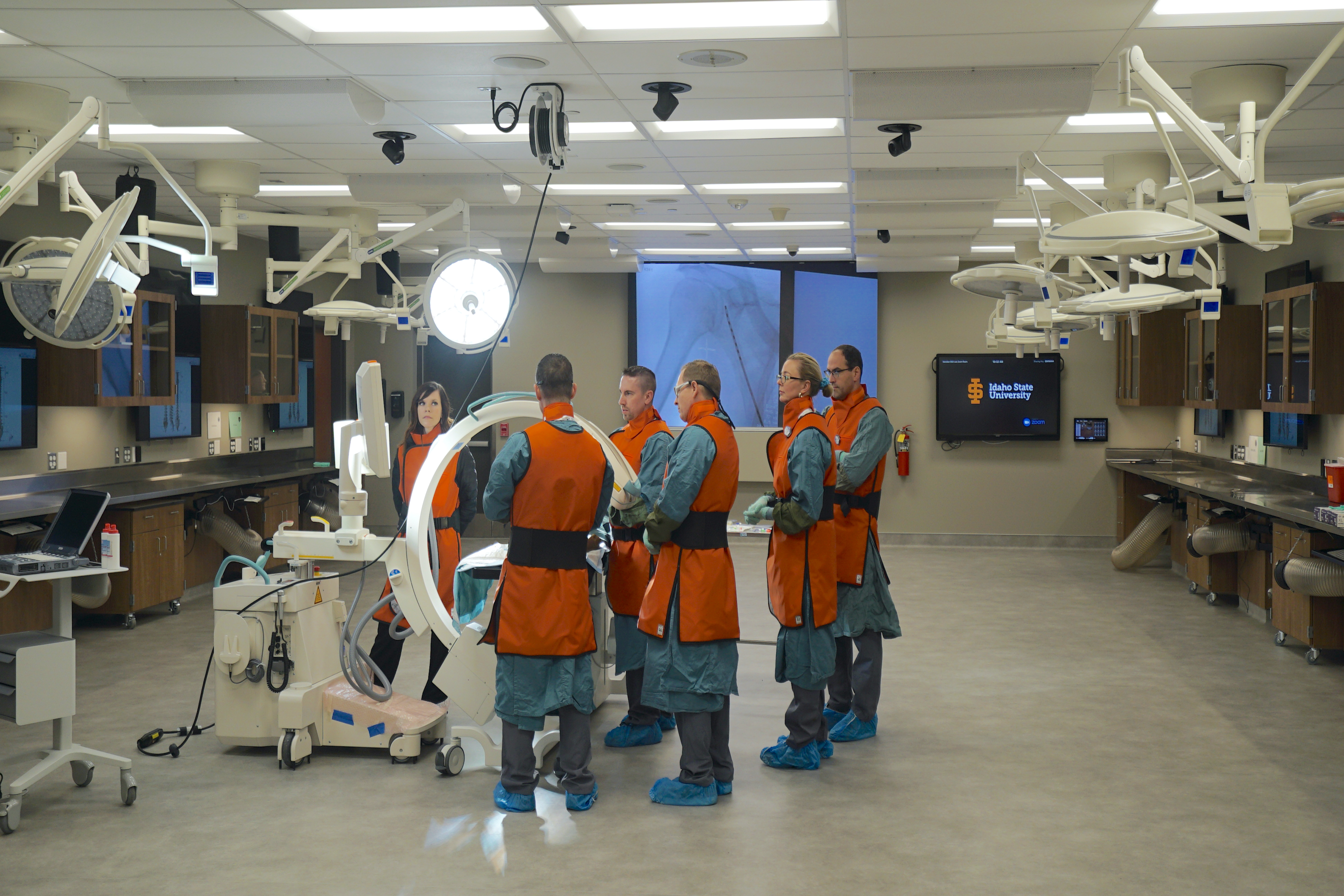 Physicans around table in lab