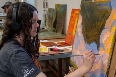 Students work on painting art projects