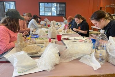 Students work on ceramics art projects