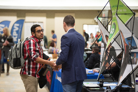 Student and potential employer at an ISU Career fair
