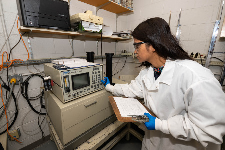 Student working with lab equipment.