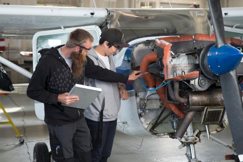 Students in an airplane shop
