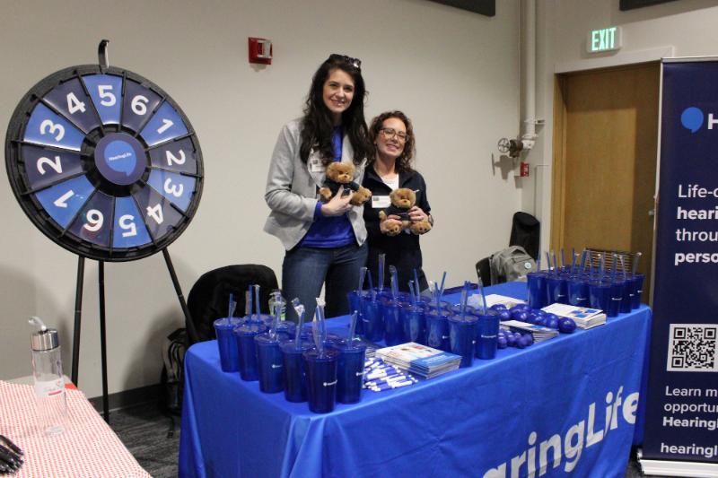 Employers at a career fair booth