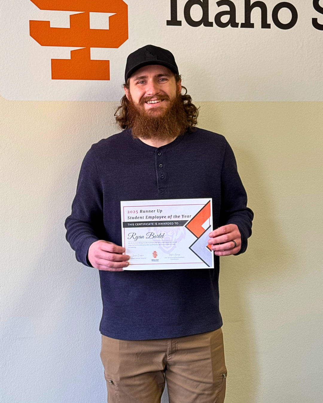 Ryan Bartell holding the runner up award for Student Employee of the Year.