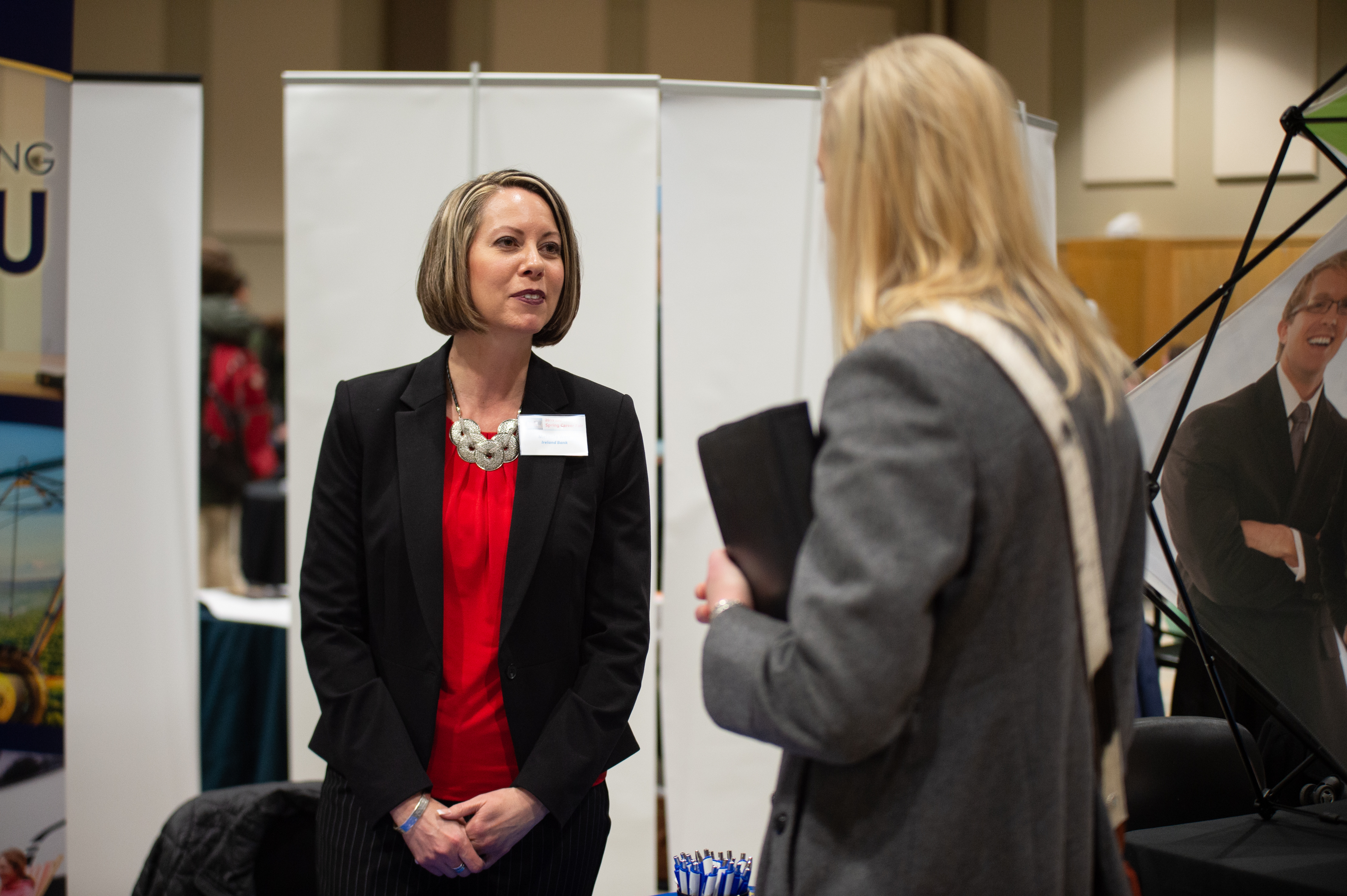 An employer and a student talking at a career fair