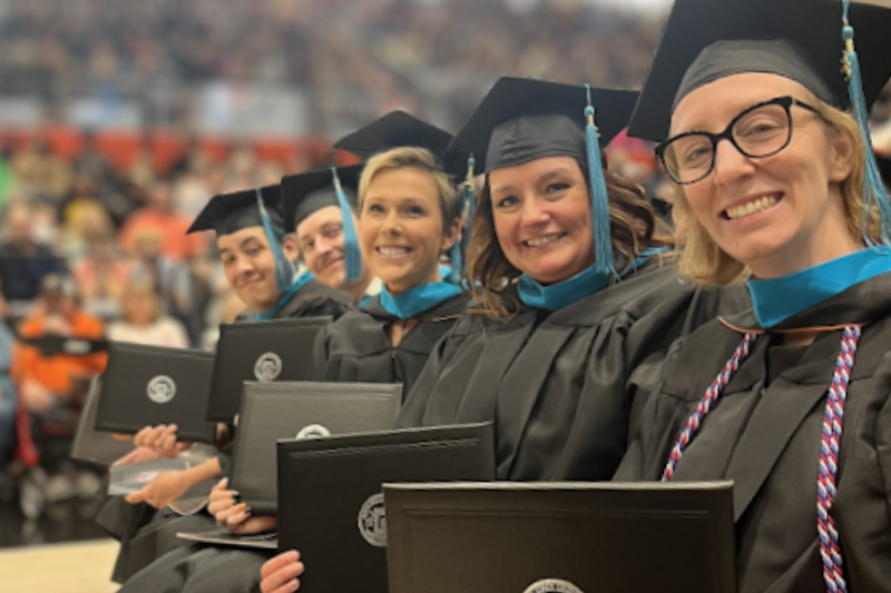 A group of graduates in their commencement regalia