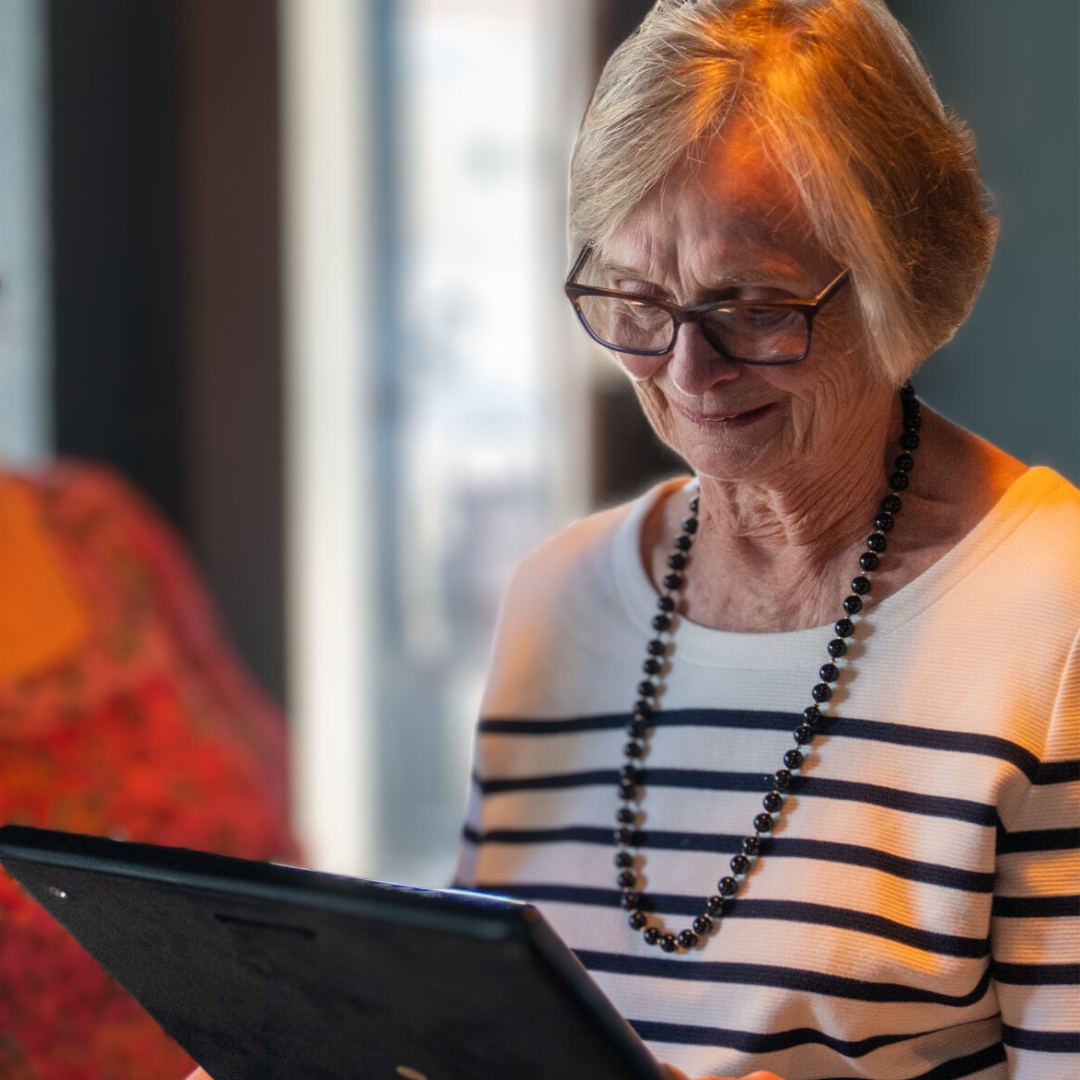 Ann Hunter looks down at her endowment plaque