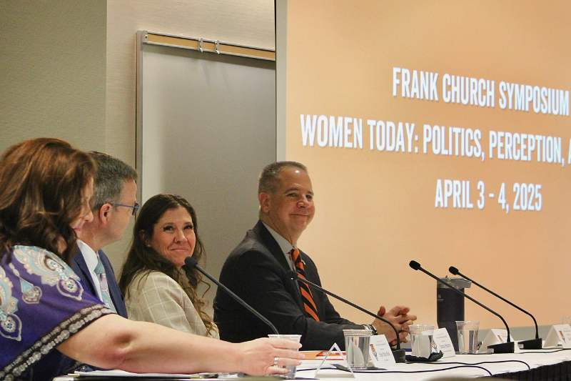 panelists at a table, including Pres. Wagner