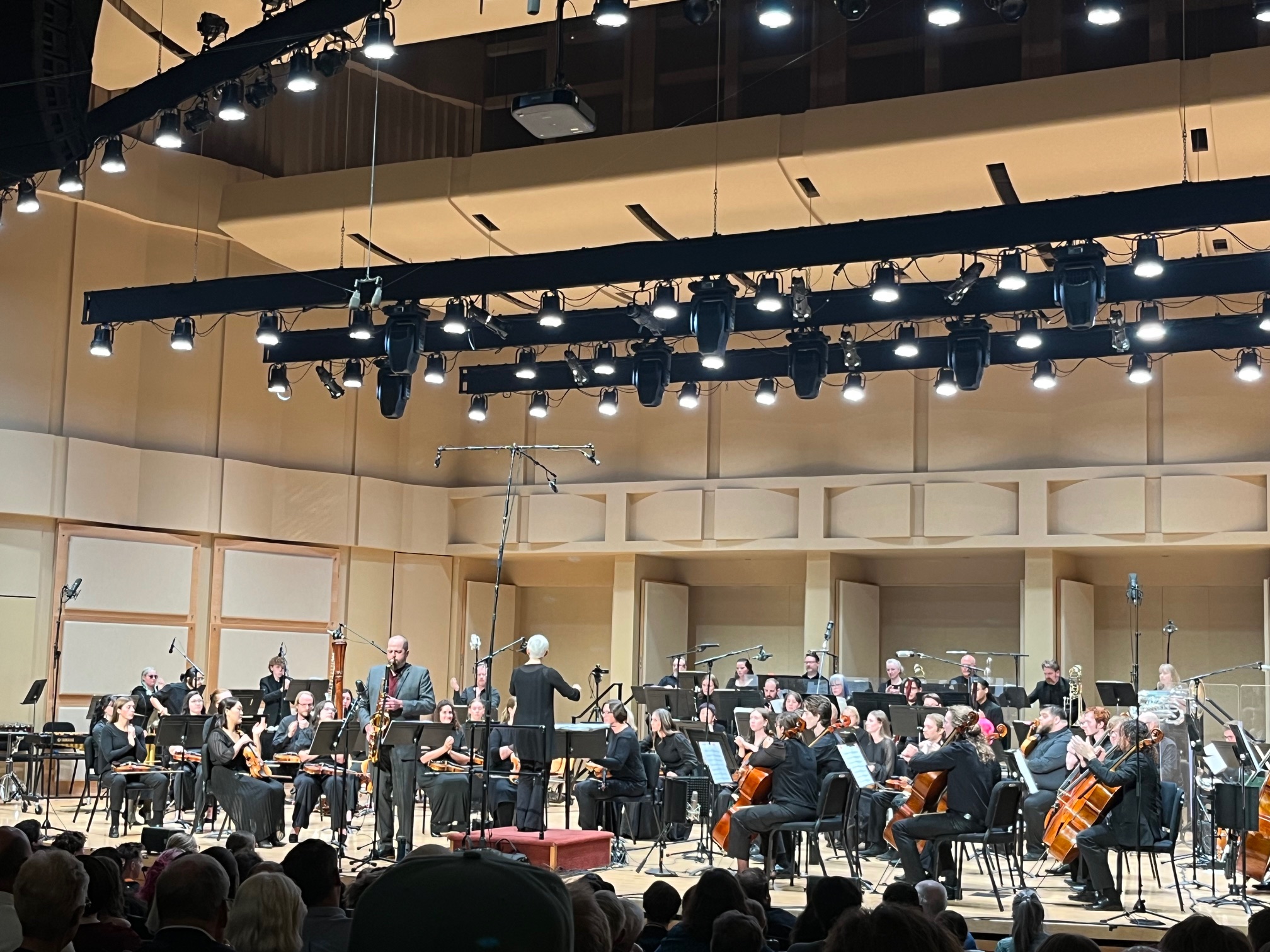 Symphony performs onstage with soloist Jon Armstrong on tenor sax