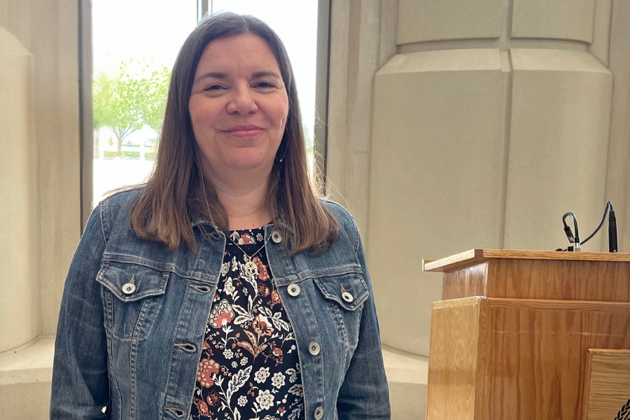 Headshot of Jennifer McDonald standing next to a podium