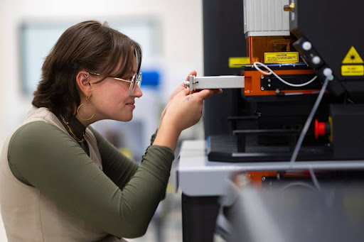 Cheyenne Bartelt, a master's student in geology, loads Zircon samples into ISU's mass spectrometer and laser ablation system