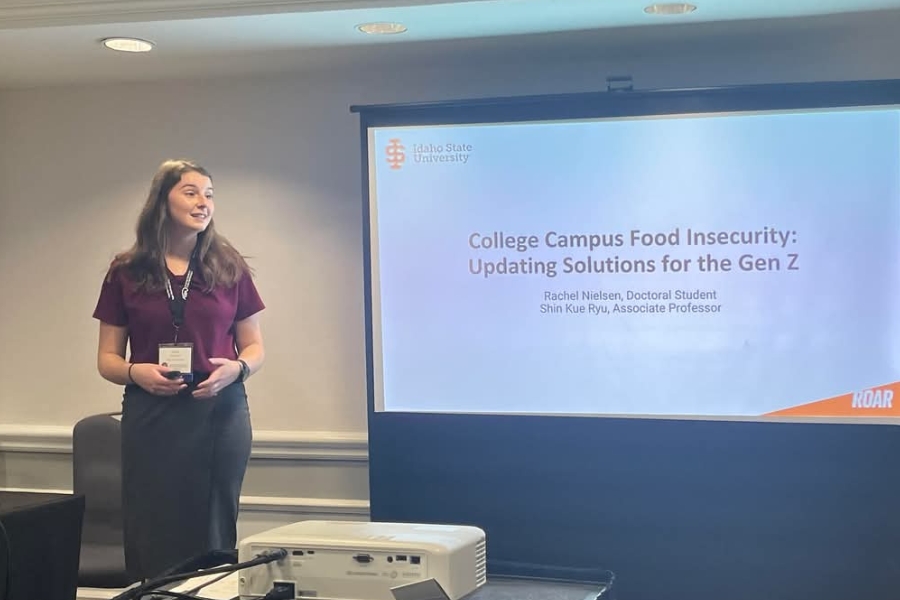 Rachel Nielsen presenting her research on a projector