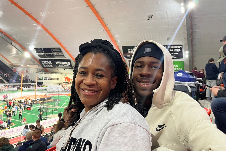 The Lees cheering on student athlete, Lyric Lee.