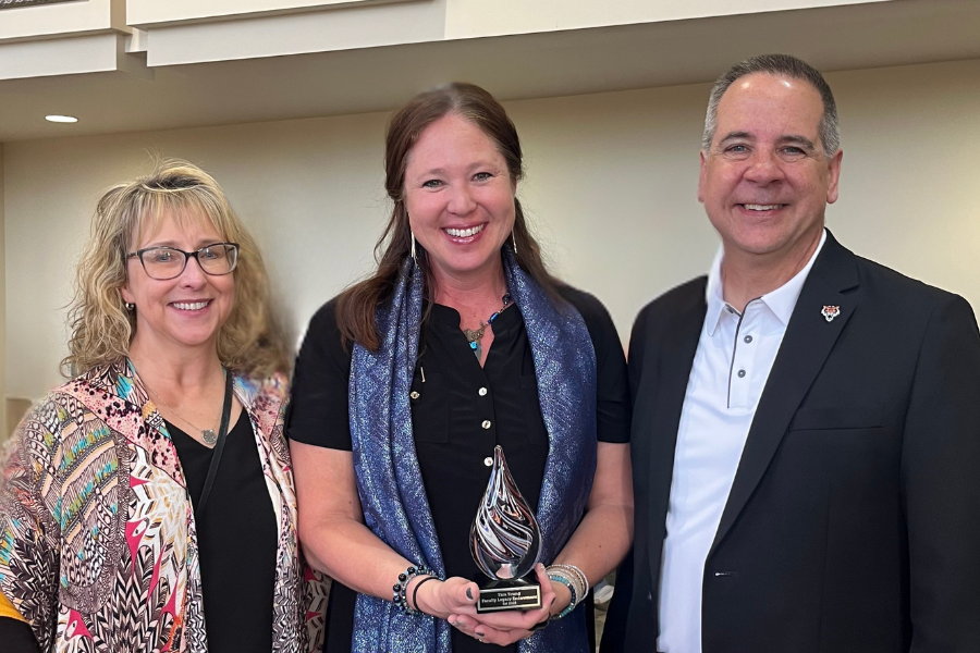 Tara Young standing with President Wagner and Kandi Turley-Ames