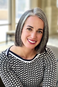 Portrait of Meg Holmes, Promotions Director and Business Manager for the School of Performing Arts