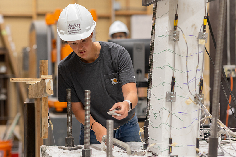 Katie Hogarth, a doctoral student studying civil engineering at Idaho State University in Pocatello, takes measurements on a reinforced concrete column on Tuesday, May 02, 2023. Hogarth was named the winner of the Charles Pankow Student Fellowship by the American Concrete Institute (ACI) Foundation.