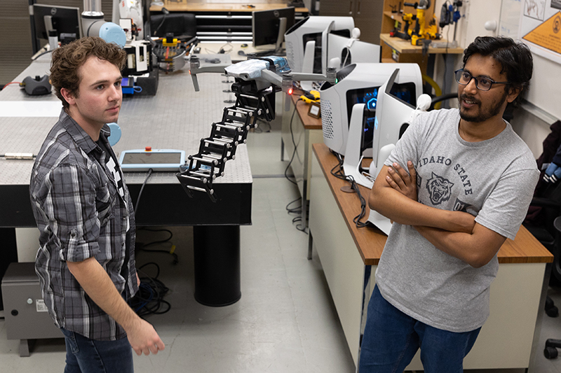 Two students fly a drone as part of their final project with ISU's Department of Mechanical Engineering.