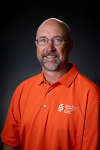 Lucas Bloxham Welding Instructor holding a fish