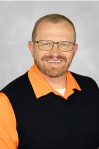 Nash S. Johnson Instructor/Clinical Education Coordinator PHYSICAL THERAPIST ASSISTANT PROGRAM, standing with his family