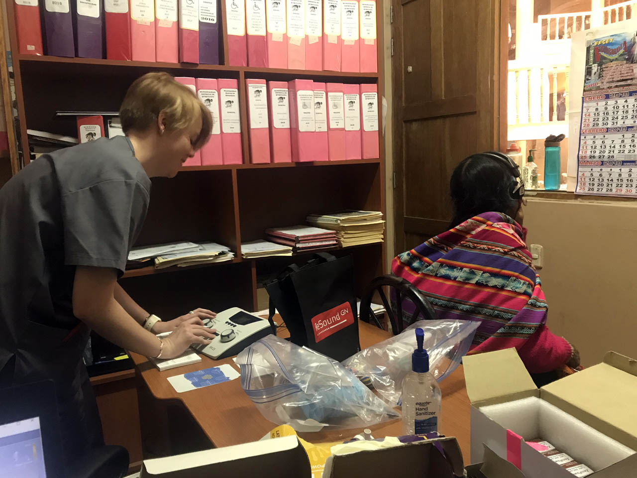 2nd year audiology student testing a patient's hearing