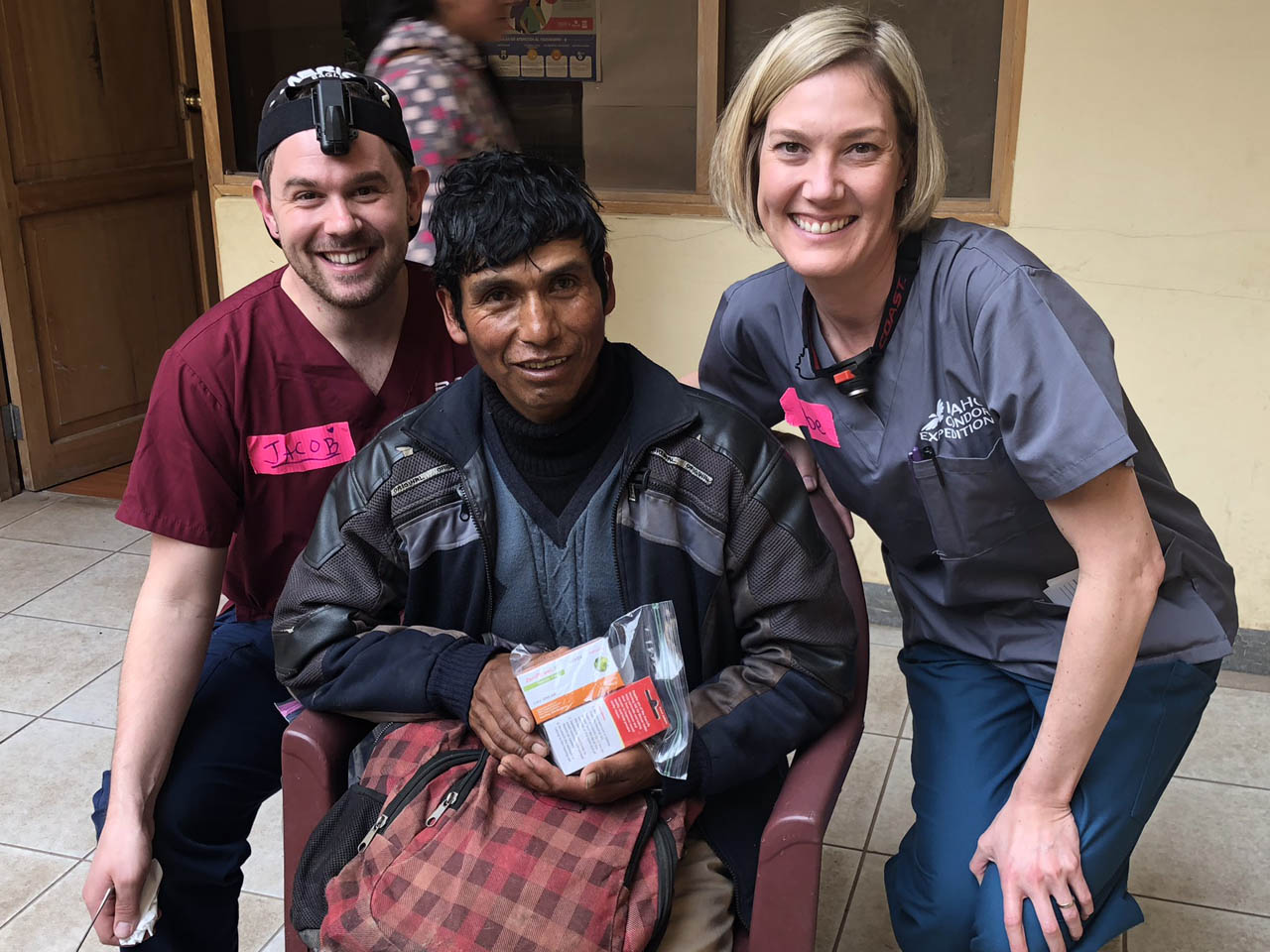 Audiologists with a patient who just received a hearing aid