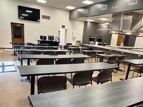 ISU's foods lab hybrid classroom with table desks and direct access to the kitchen