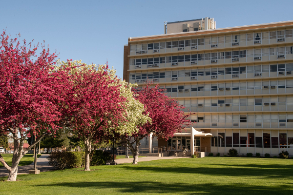 front view of Idaho state garrison building from a distance with colorful spring trees