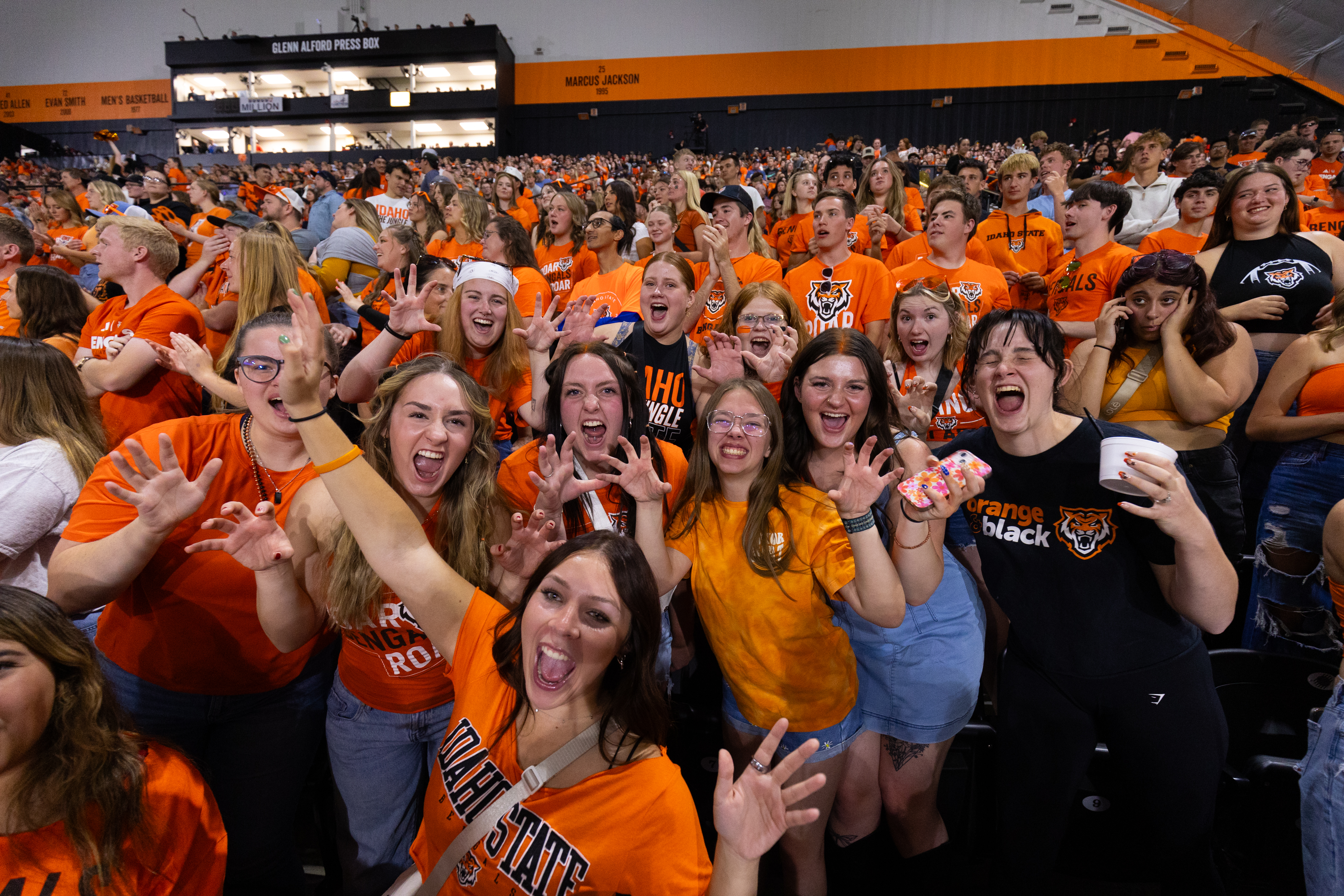 ISU students dressed in orange at a homecoming game