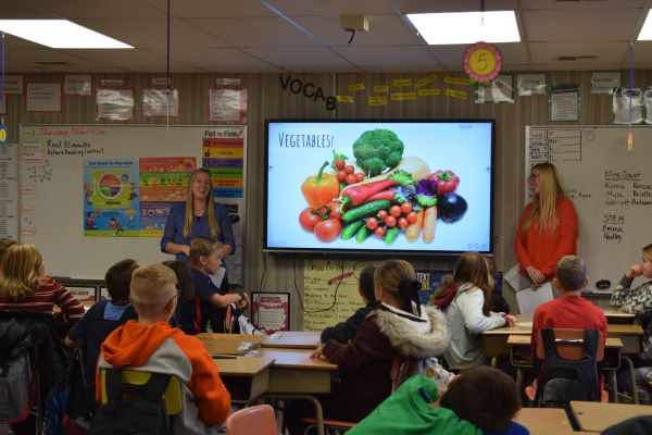 nutrition students giving a presentation to elementary school kids