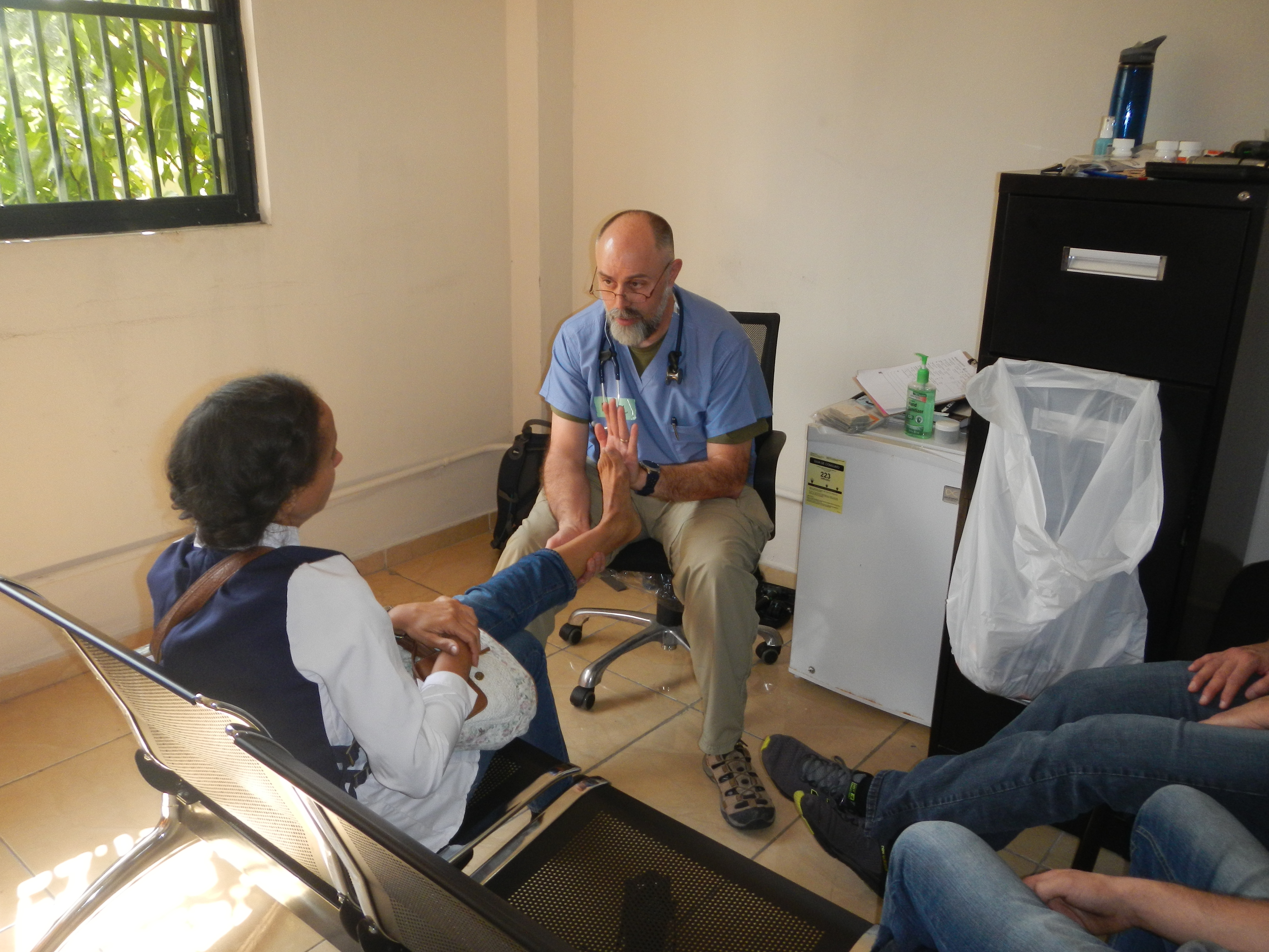 Medical provider works with a patient's leg