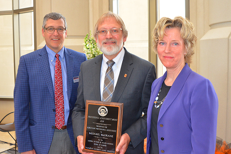 Dr. Rex Force and Karen McNeill award Michael McGrane the School of Nursing 2018 Professional Achievement Award