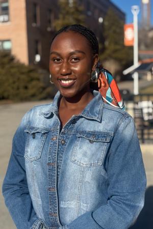 Mica Kankolongo smiling on campus