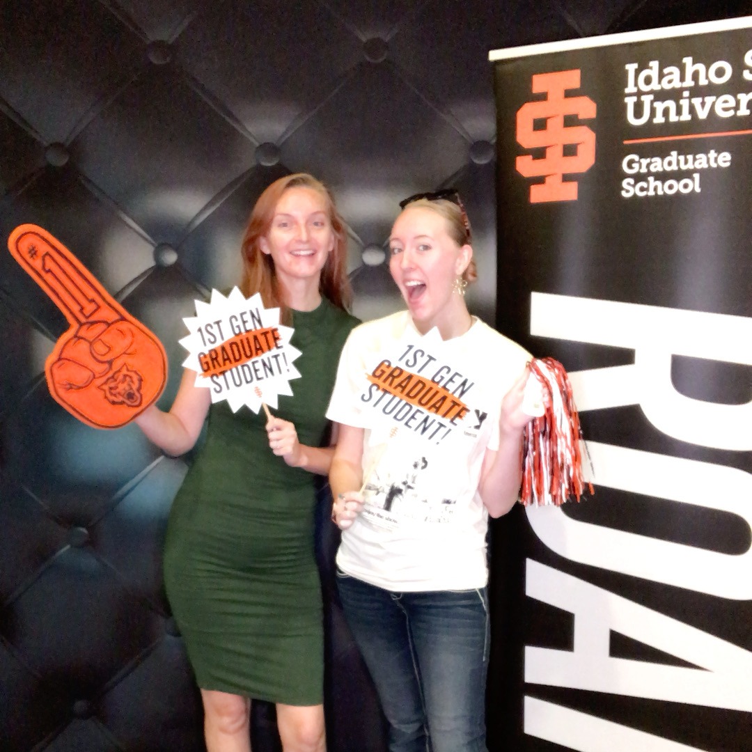 2 students at orientation posing with photobooth props for a photobooth picture