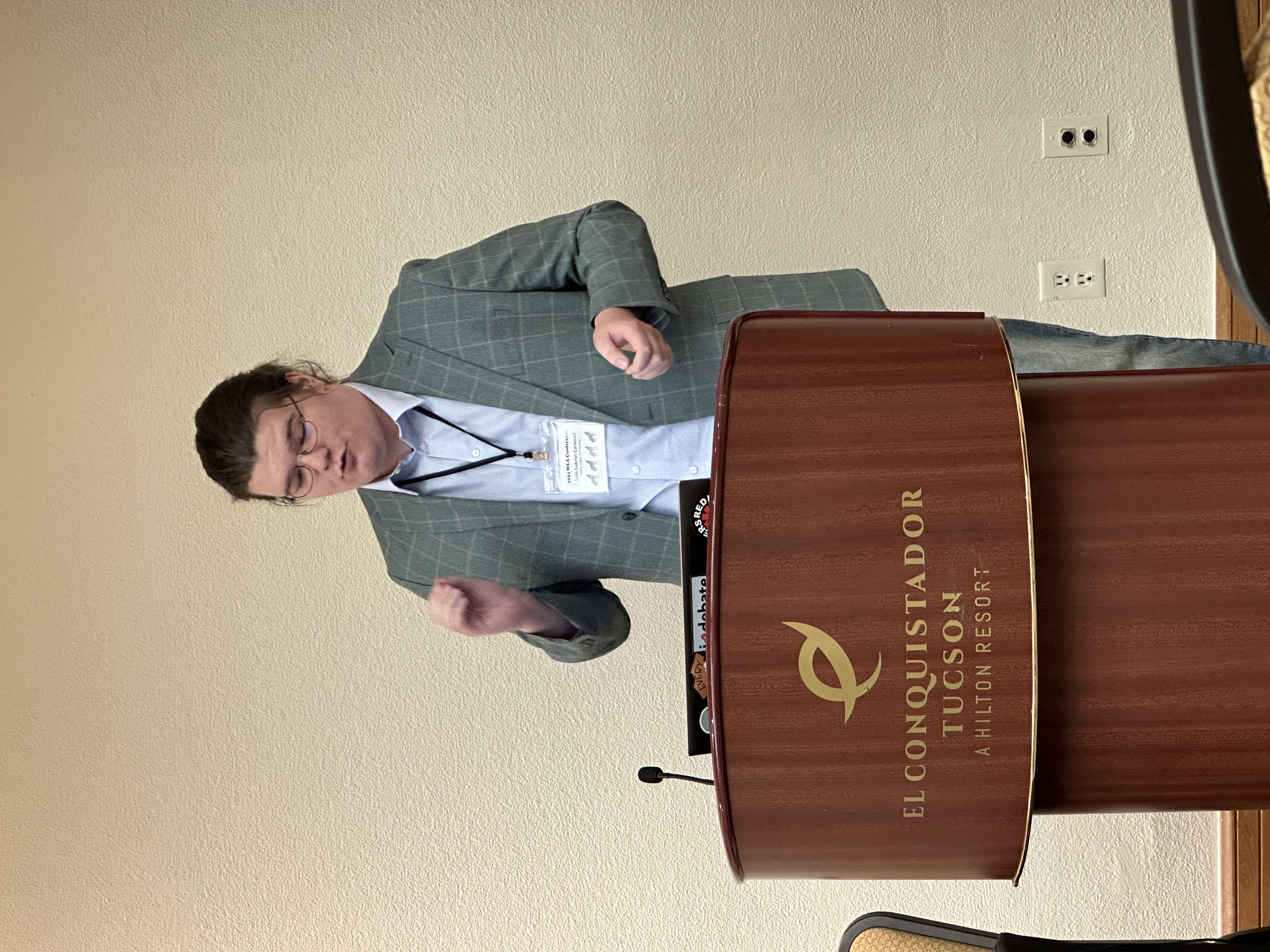 Seth Garwood presenting behind a podium