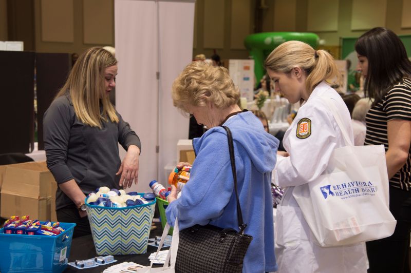 Attendees visiting health fair booths