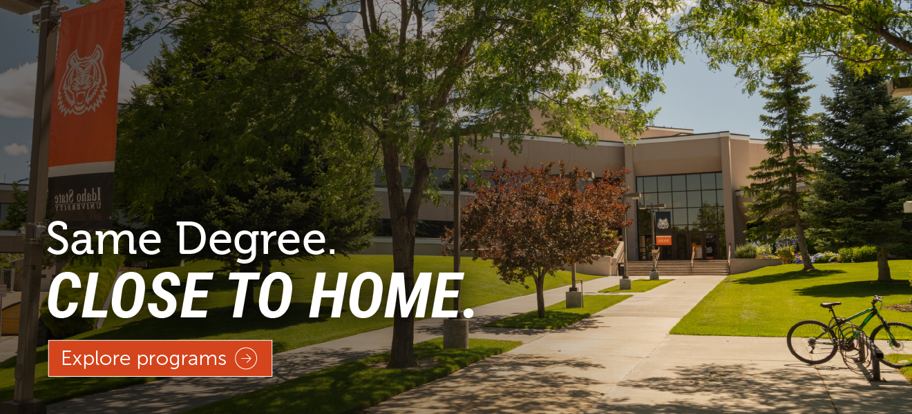 Idaho State University Idaho Falls campus building with a tree-lined walkway and green lawn. Text overlay reads “Same Degree. Close to Home.” with an “Explore programs” button.