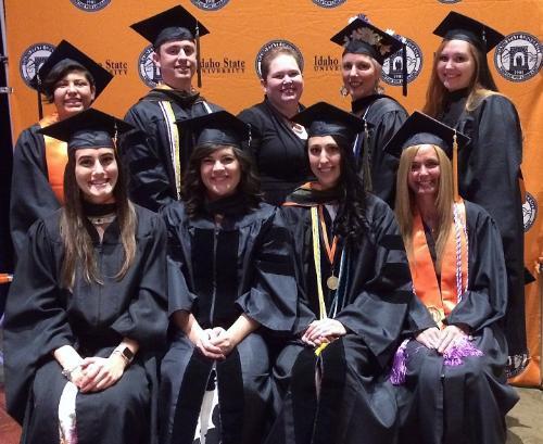 Nine students posing for group photo