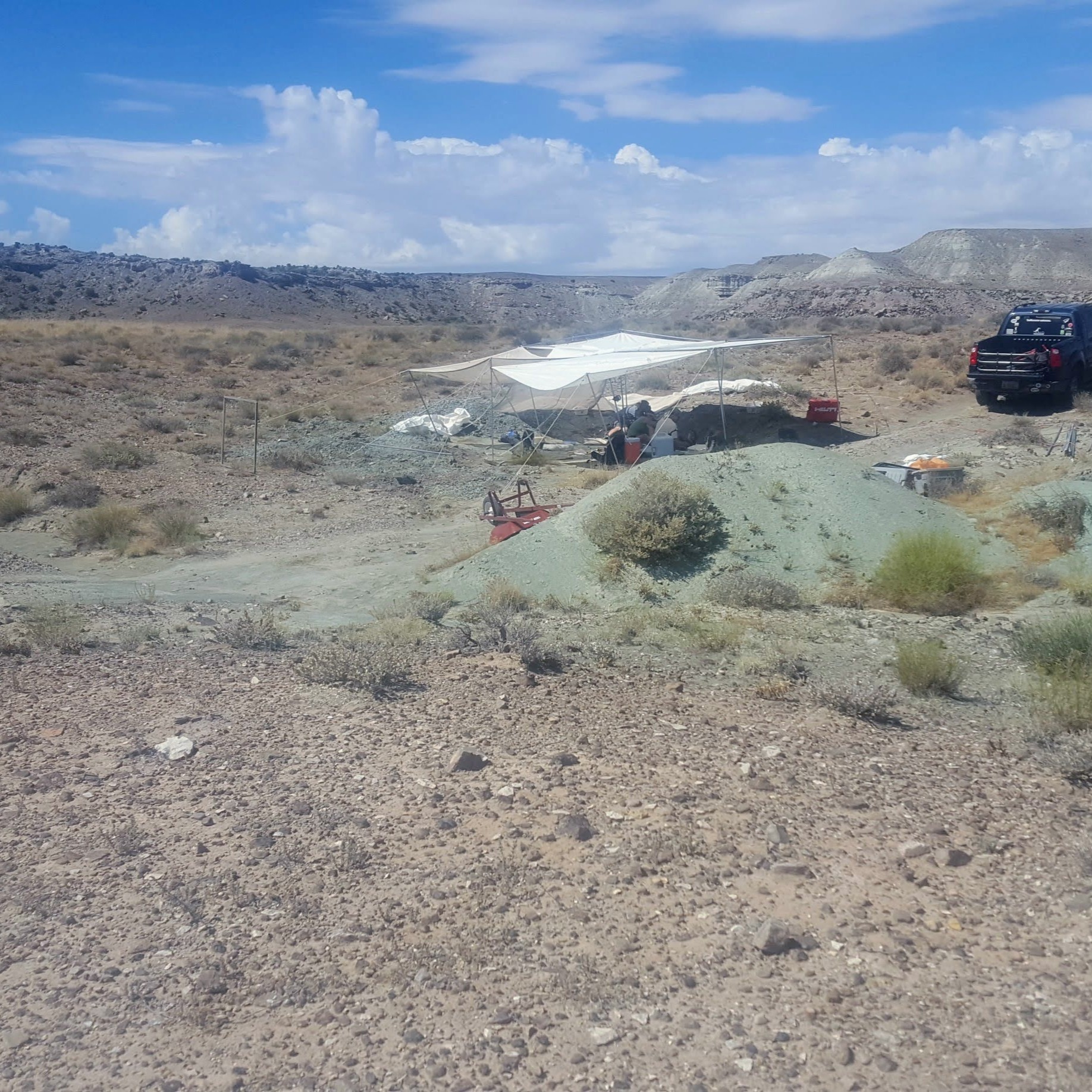 Wyoming landscape with a sun tarp over field crew