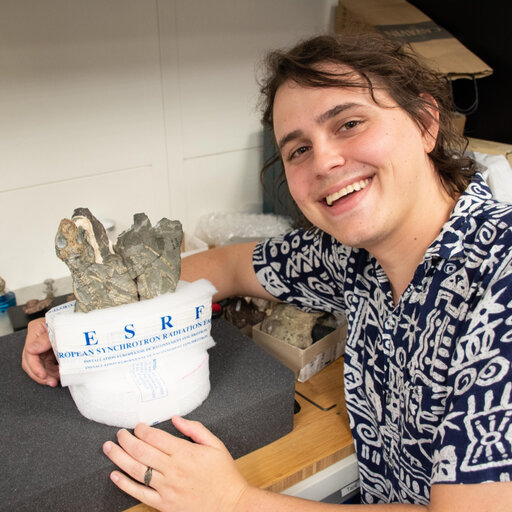 Xavier Jenkins with a specimen in collections