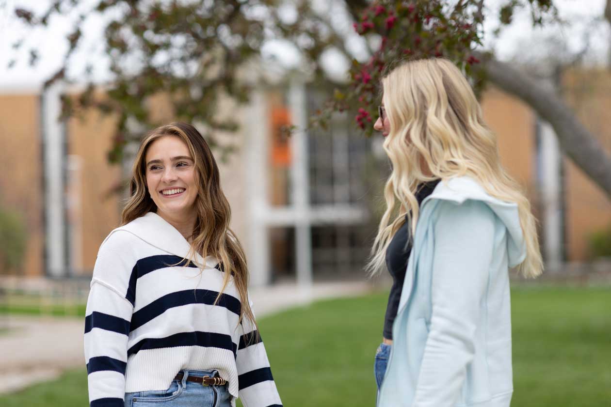 Two students on the ISU Quad