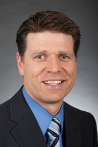 A man posing for a photograph