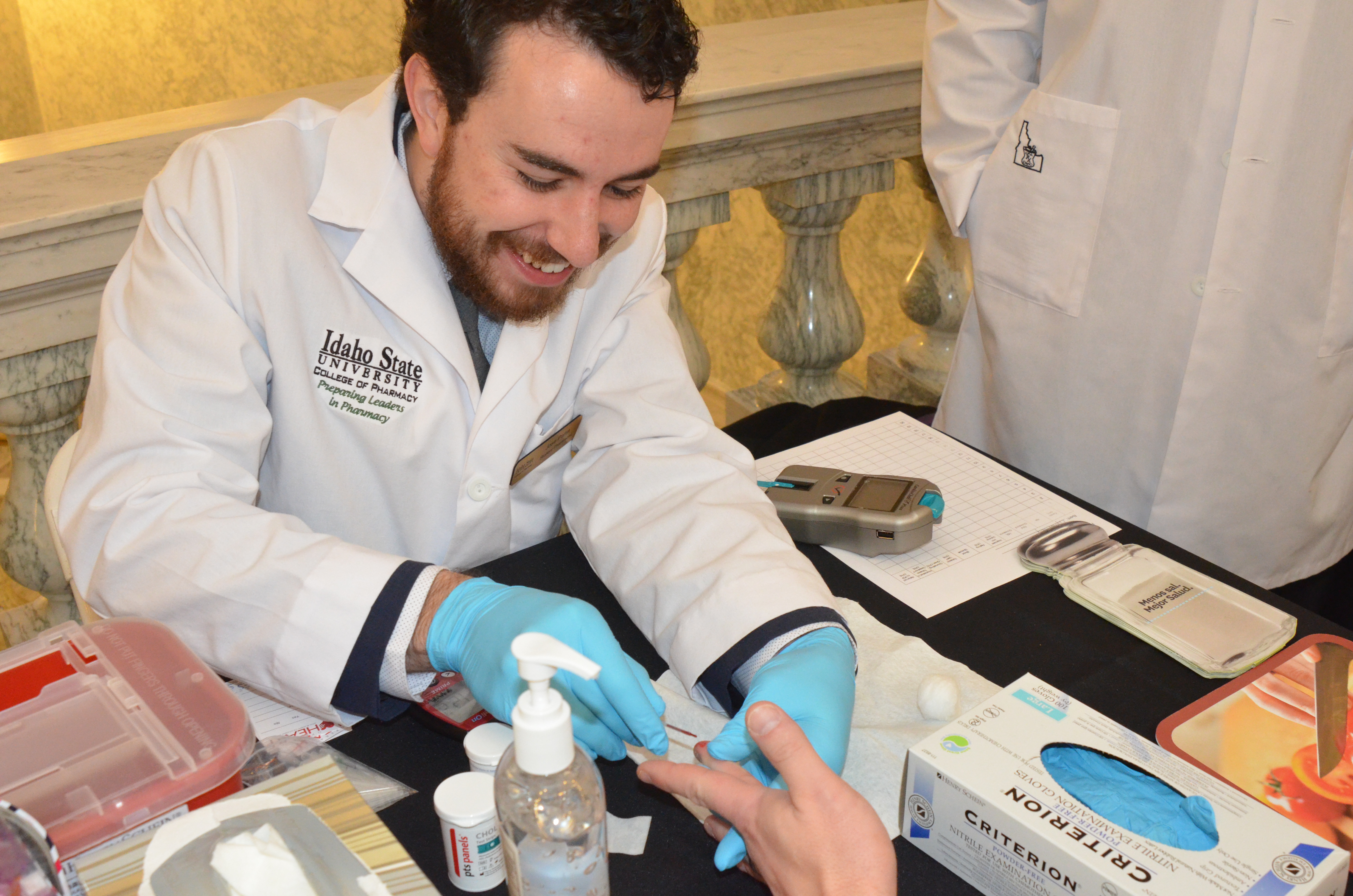Pharmacy Student Performing a Blood Test