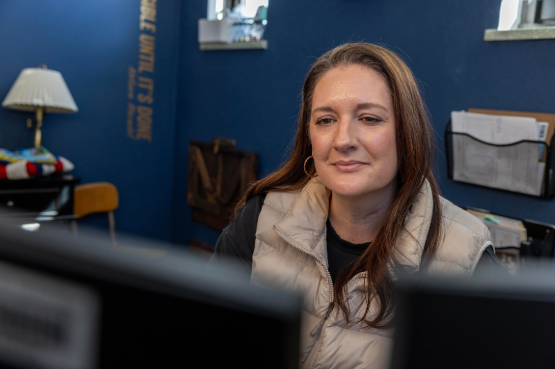 Teacher looking at computer screen
