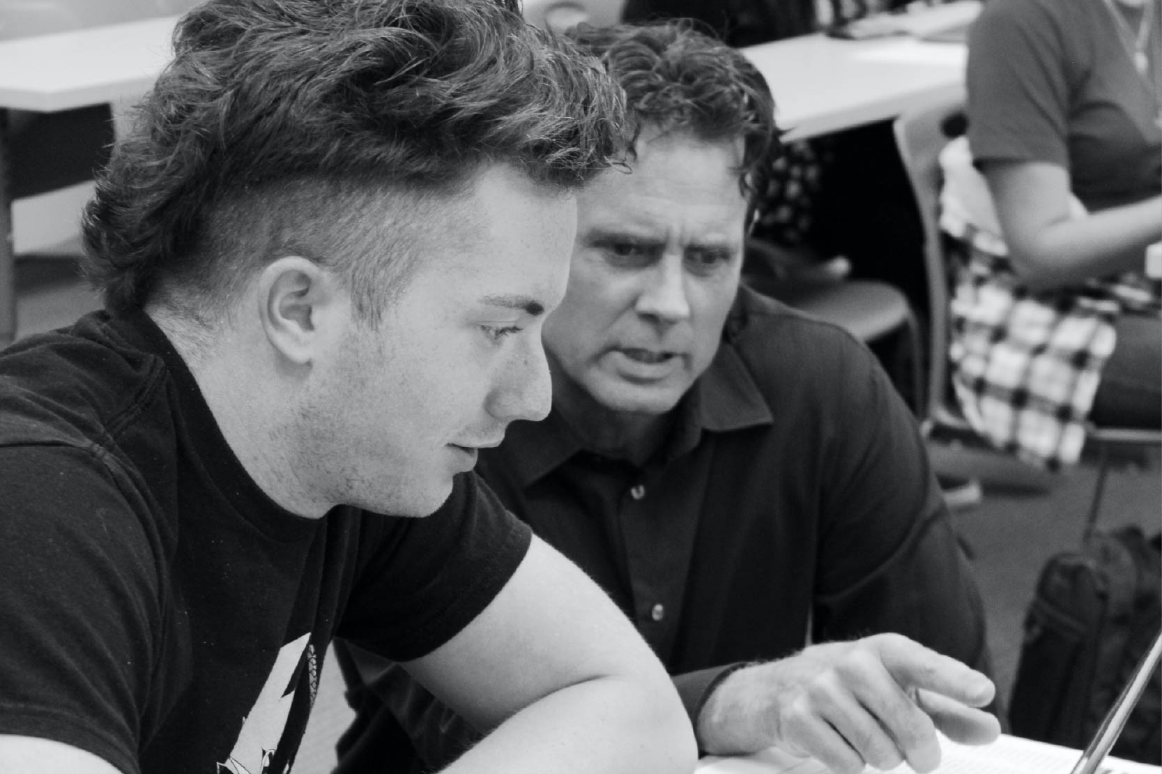 Bengal Bridge student working with their instructor in a MATH 1153 class.