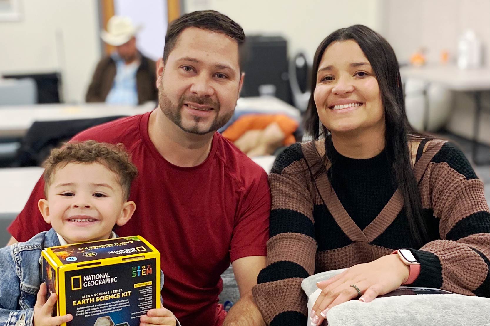 HEP non-traditional student pose with their family.