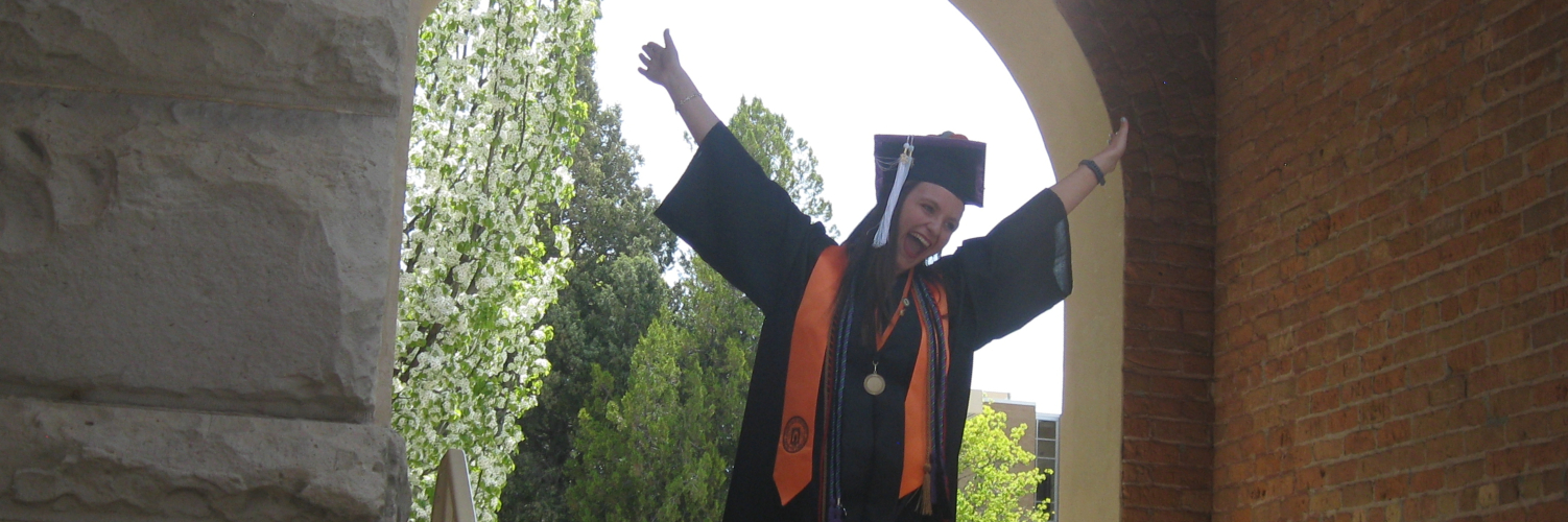 Student celebrating marching back through the Swanson Arch