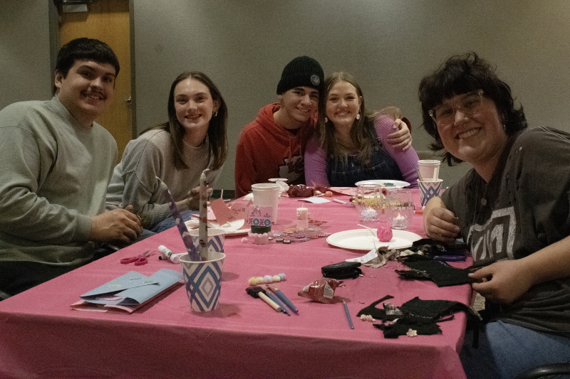students at table with decorations