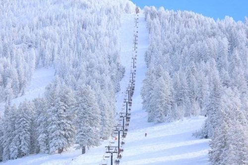 Ski lift on a snowy mountain.