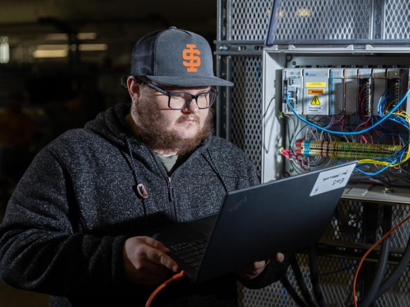 Man works on computer