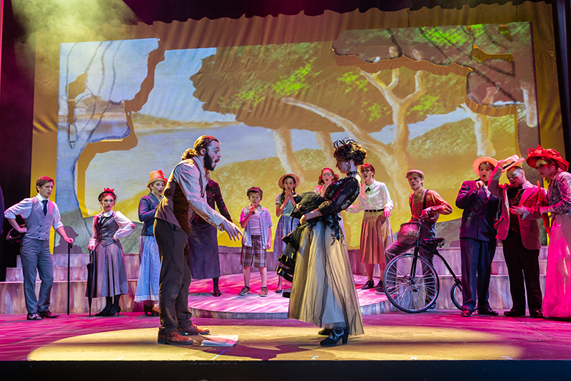 Actors on stage during a performance of Sunday in the Park with George